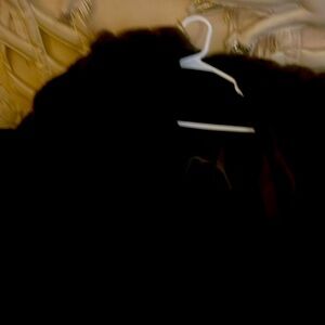 Oversized reversible chocolate fur.  Leather on one side, fur on the others.